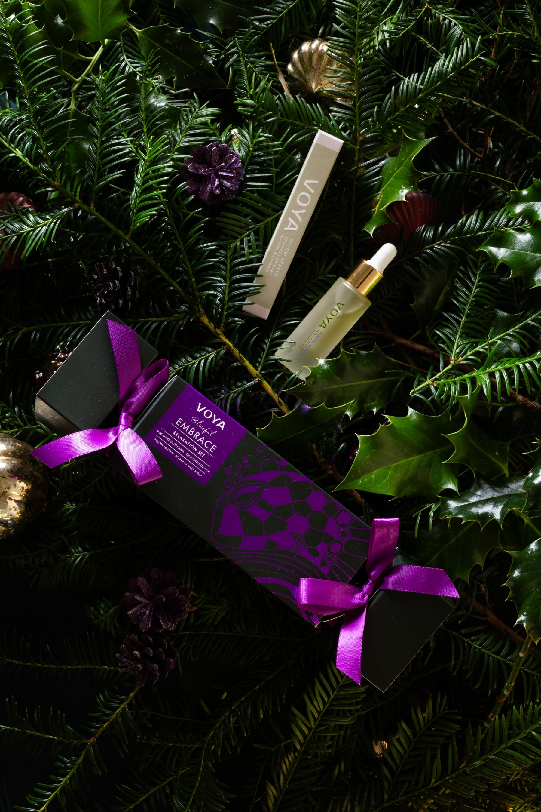 Blissful Embrace Relaxation Set packaged in a Christmas cracker. Cracker contains a Pillow Heaven Sleep Spray and a Mini Mindful Dreams Body Oil