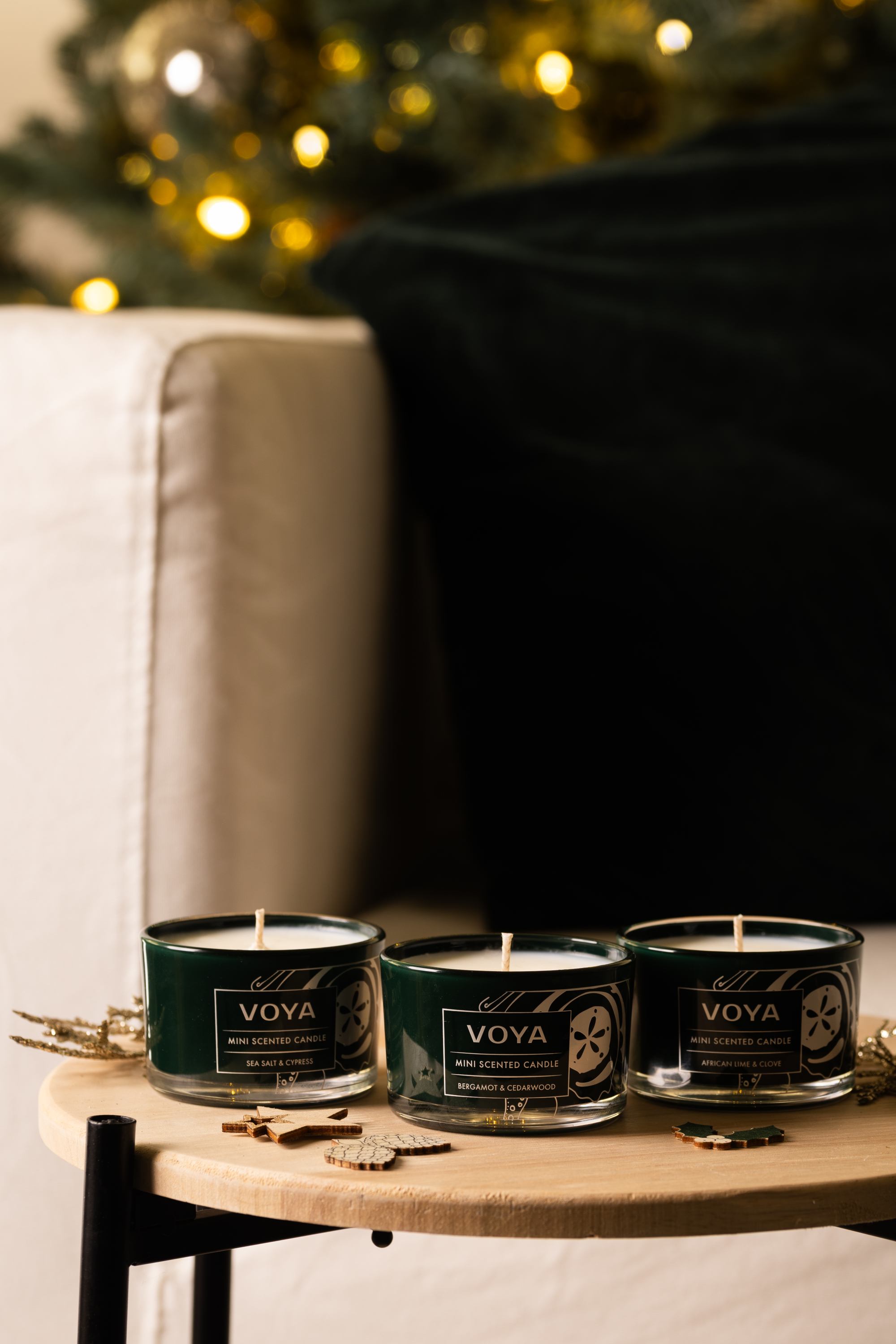 VOYA Blissful Sparks Mini Trio of Scented Candles on table.