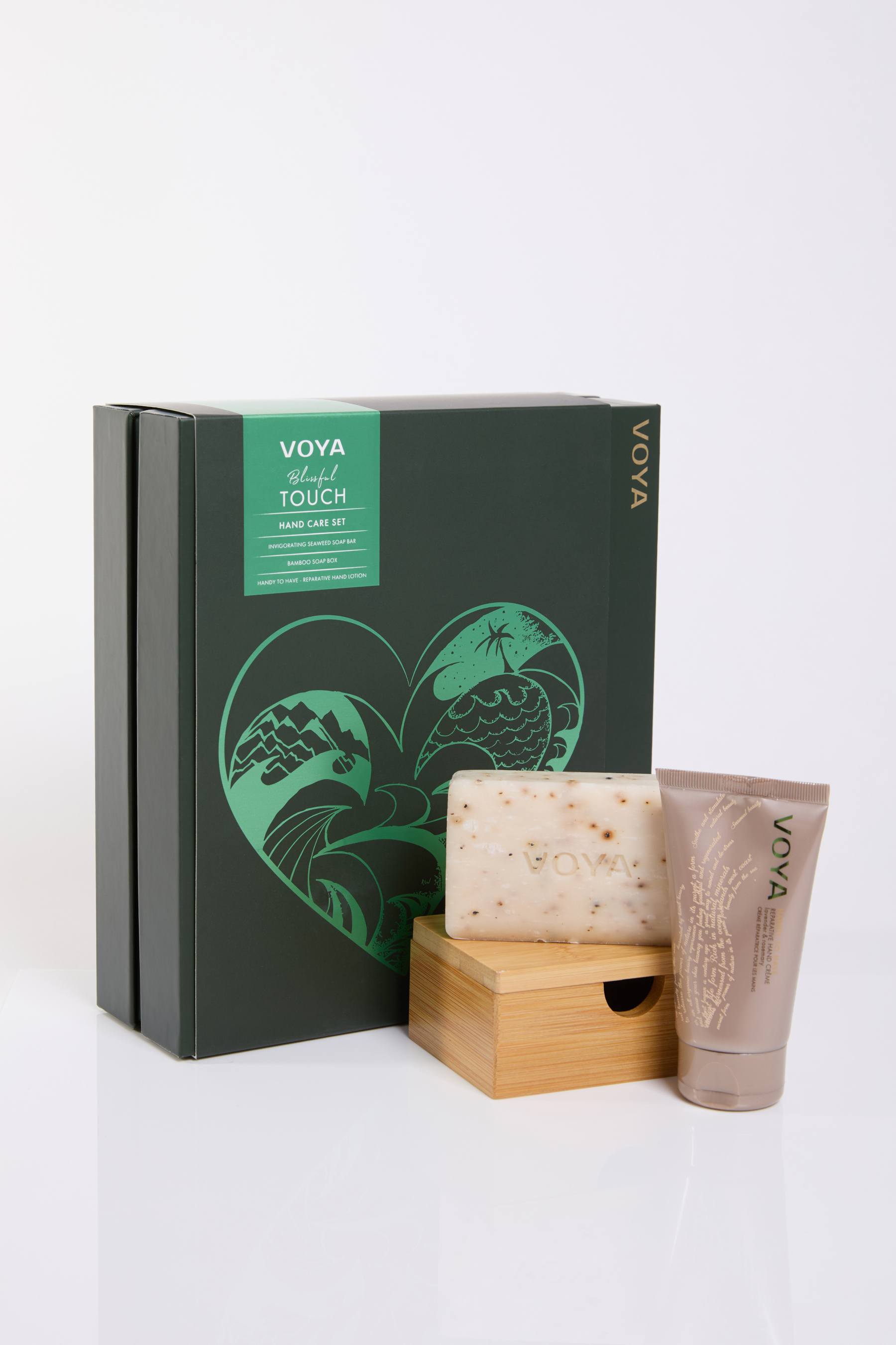 VOYA Hand Renewal Set containing Handy to Have Reparative Hand Lotion and Invigorating Seaweed Soap Bar and a bamboo soap box. 