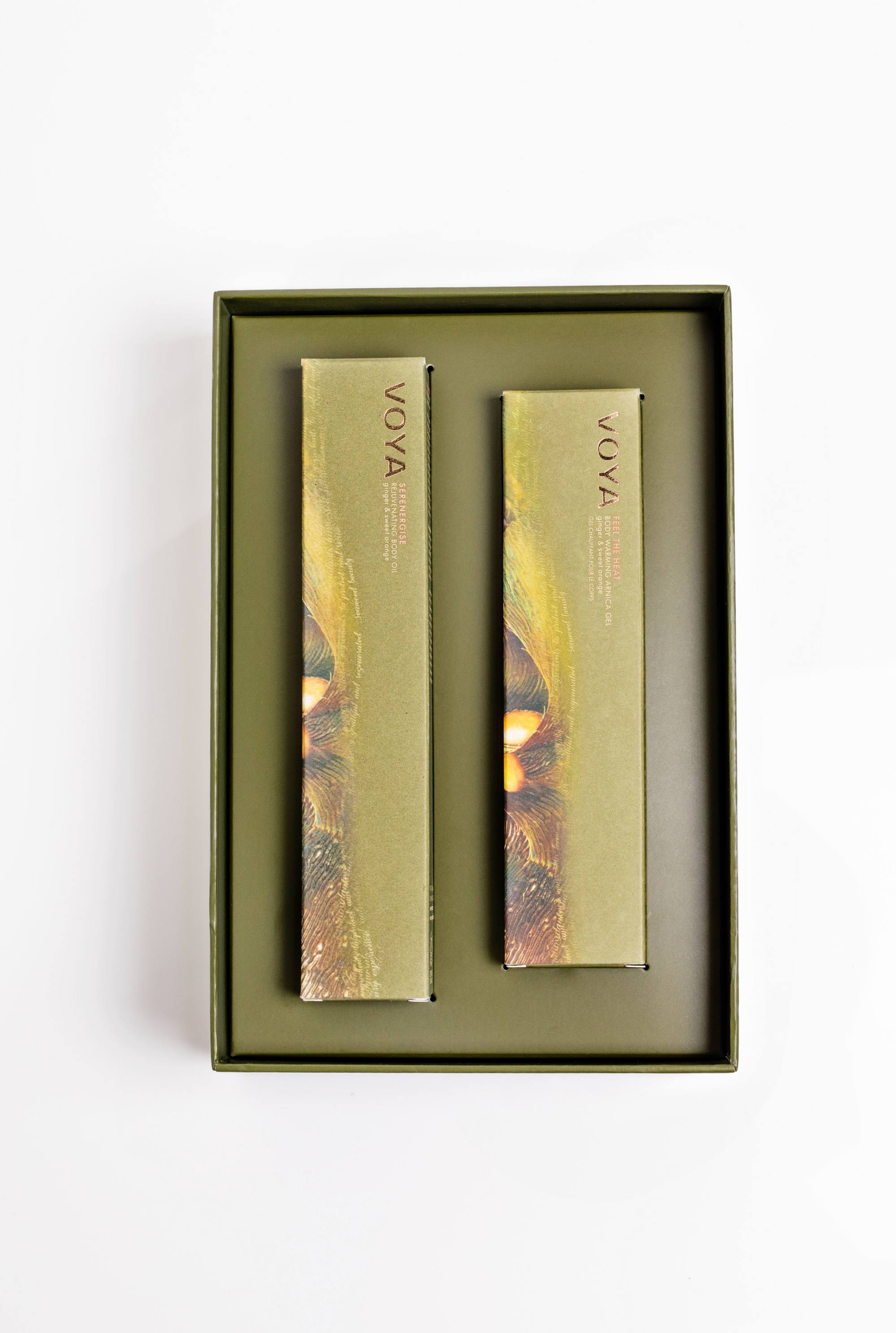 Voya body care set containing feel the heat warming gel and serenergise body oil in box