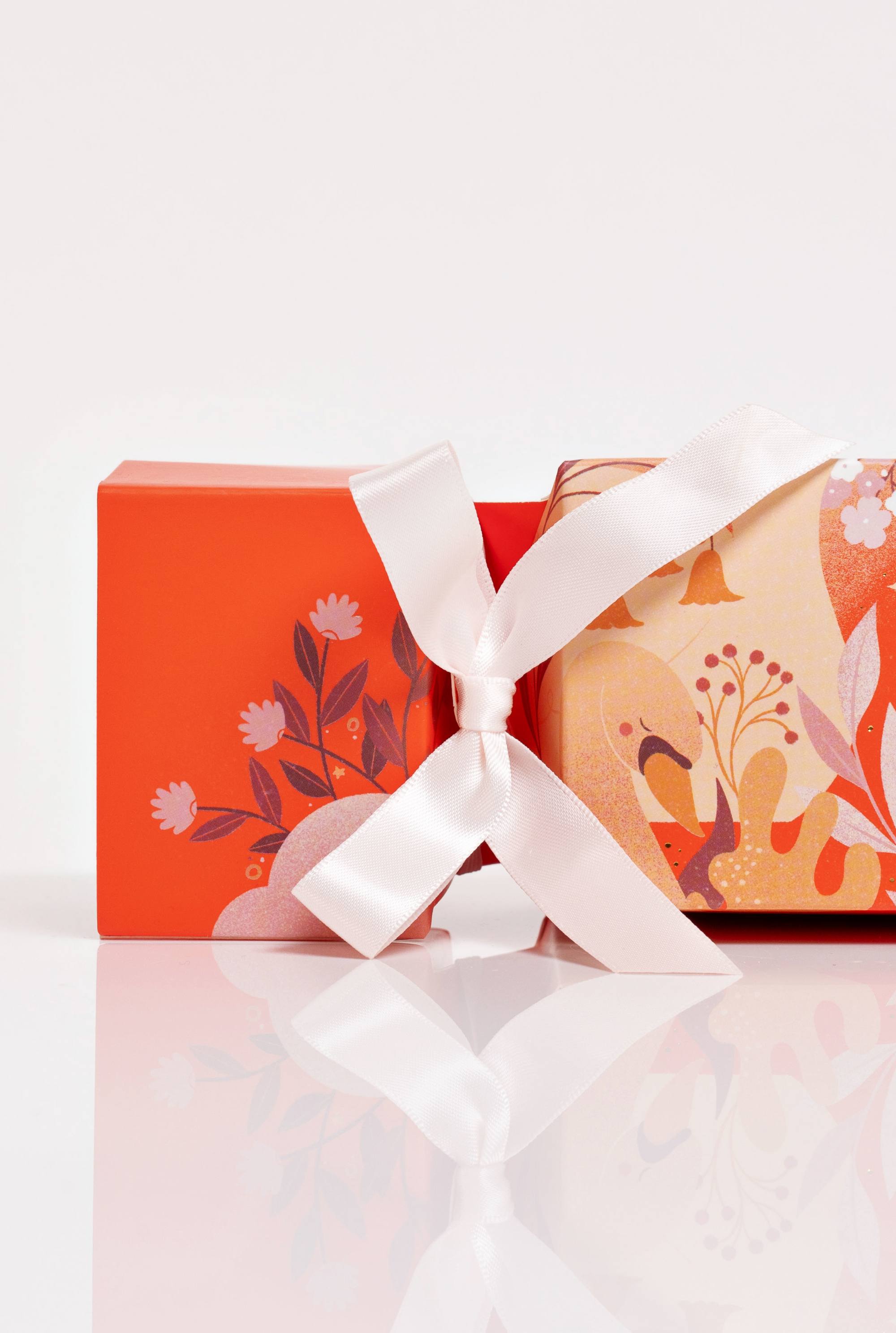 Voya Christmas cracker with roller ball and sleep spray close up with ribbon